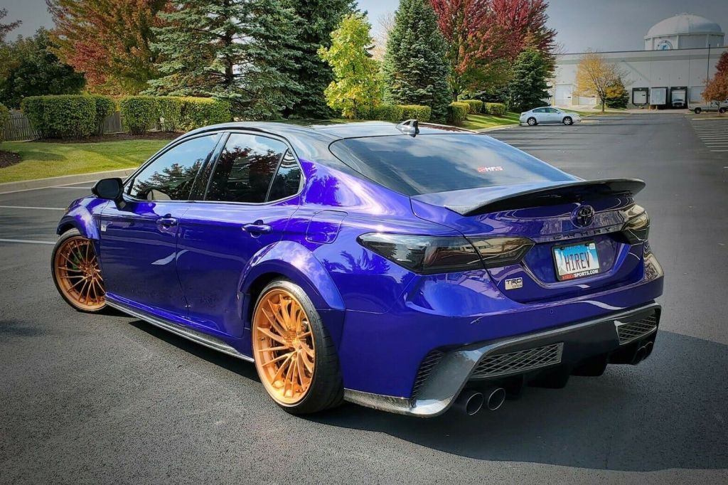 Driver's side rear angle view of custom 2018 Toyota Camry