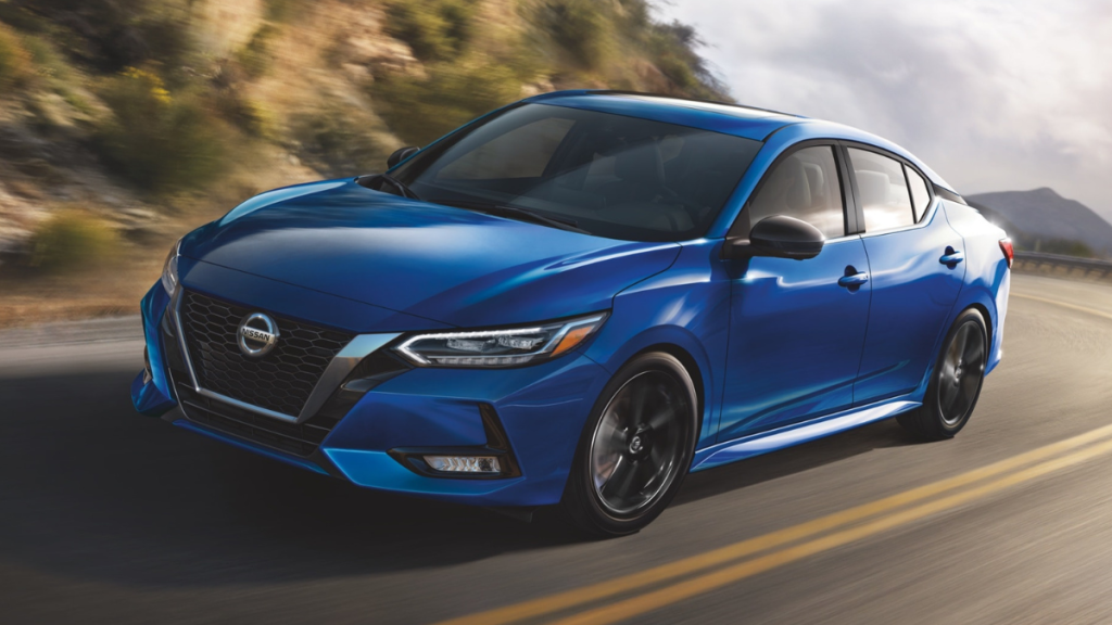 Electric Blue Metallic 2022 Nissan Sentra driving on a curvy road