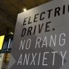 An EV sign promoting electric driving range seen during the Commercial Vehicle Show in Birmingham, England