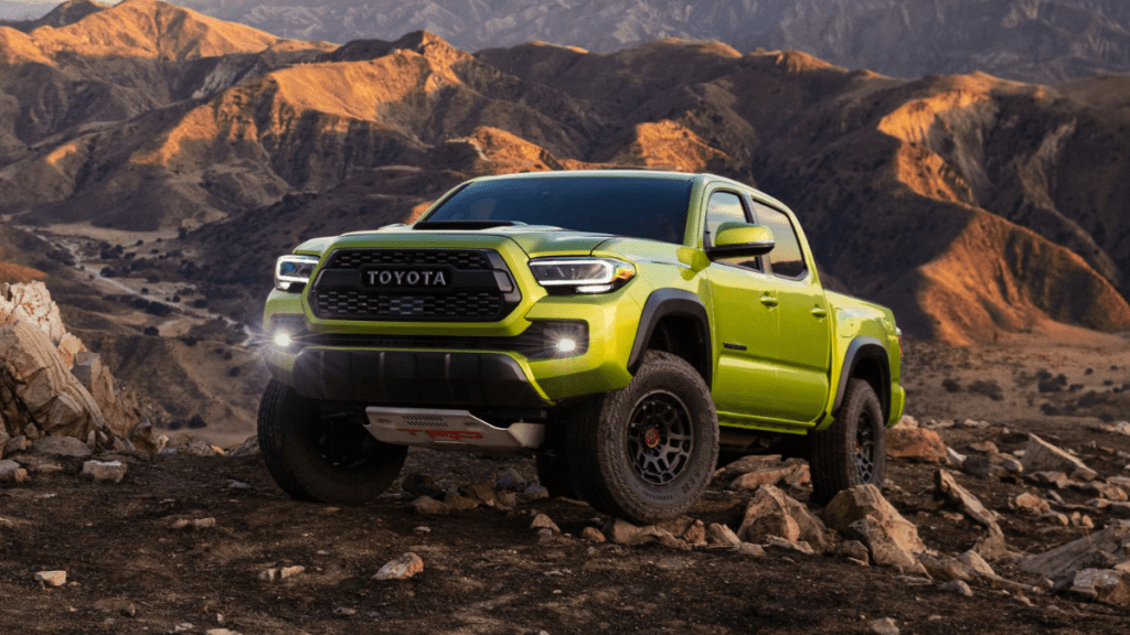 Electric Lime Metallic 2022 Toyota Tacoma parked on rocky terrain