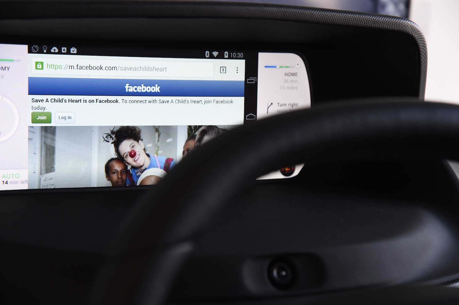 Facebook from a wirelessly connected smartphone in a car