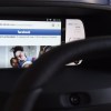 Facebook from a wirelessly connected smartphone in a car