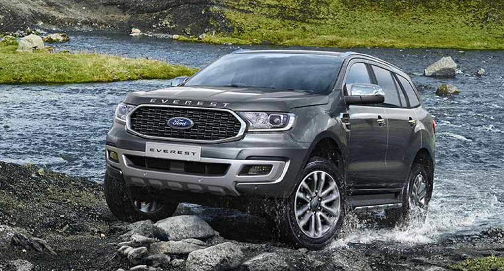 A gray Ford Everest SUV is driving off-road.