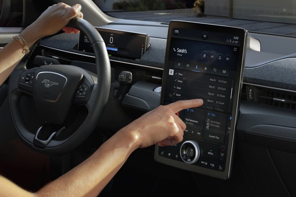 A person uses the Ford Sync 4 infotainment system, which owners cannot upgrade their Sync 3 system to.