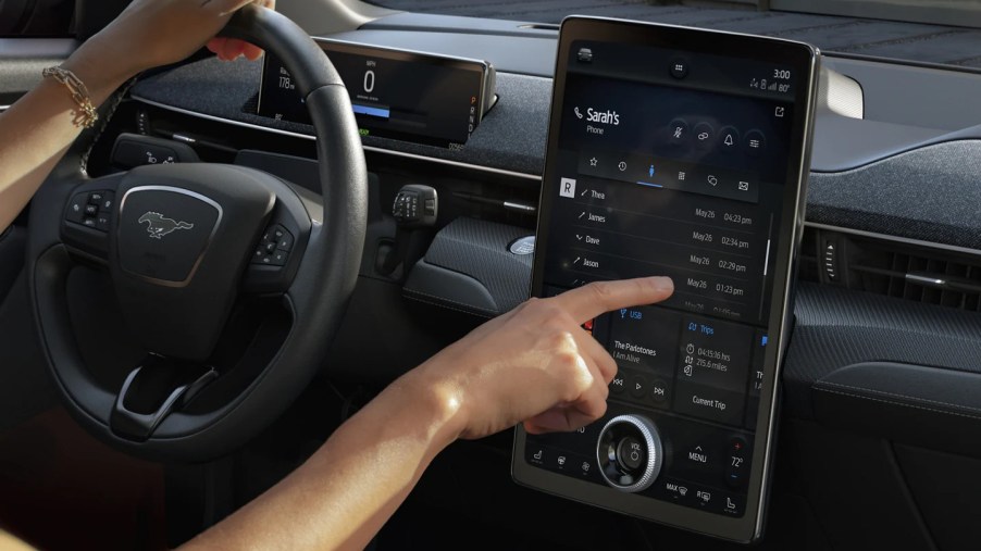 A person uses the Ford Sync 4 infotainment system, which owners cannot upgrade their Sync 3 system to.