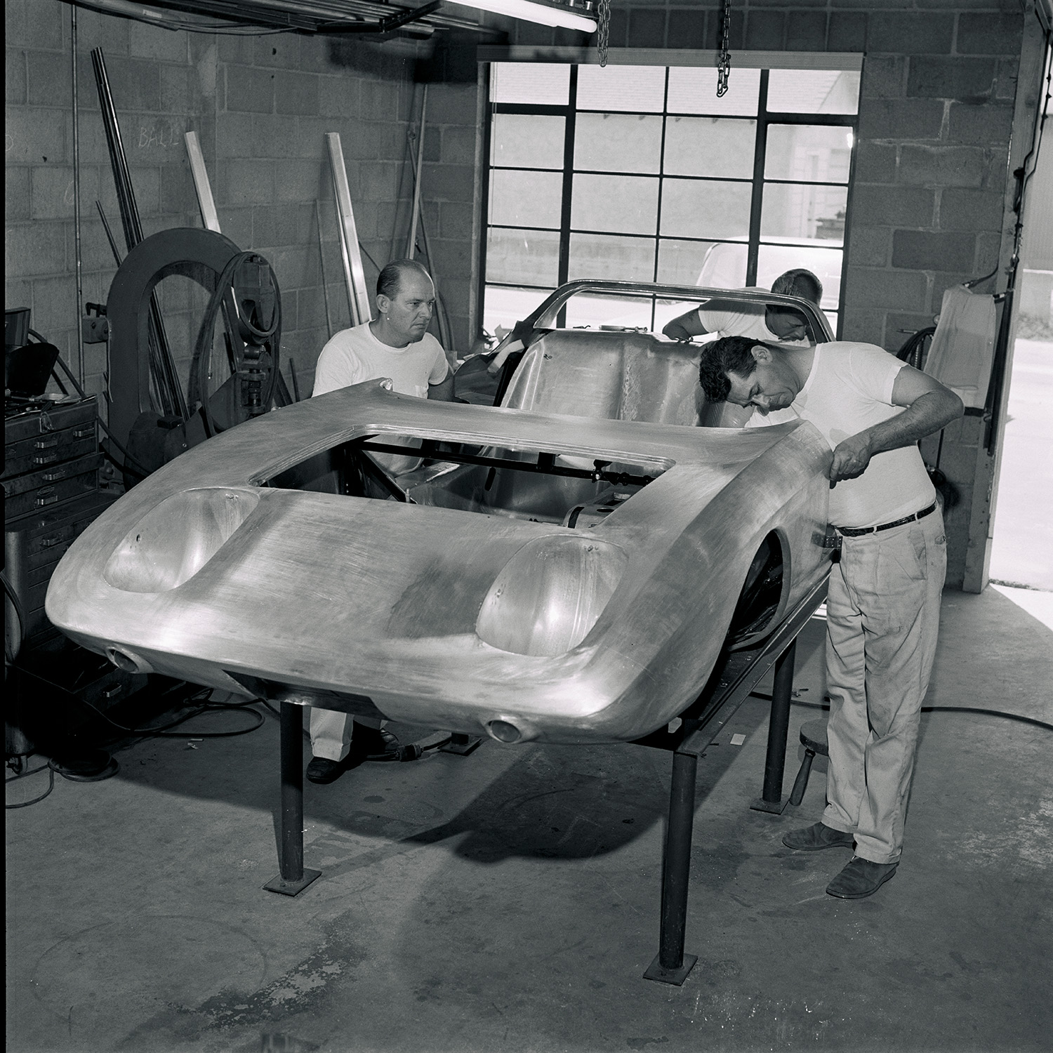 Tom Barnes, at left and Dick Troutman beat out final panels for the  first ever Mustang concept car in their Culver City shop