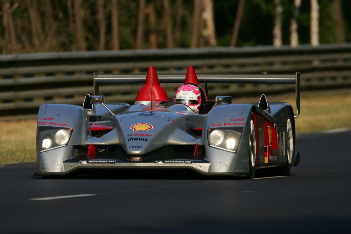 A front view of a silver and red Audi R10 TDI race car during the 24 Hours of Le Mans race.