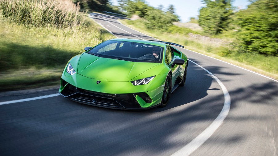 Verde Ithica Lamborghini Huracan Performonte cuope driving down road