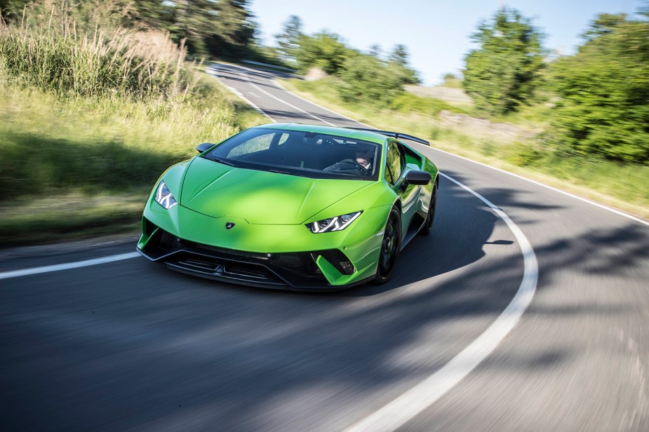 Verde Ithica Lamborghini Huracan Performonte cuope driving down road