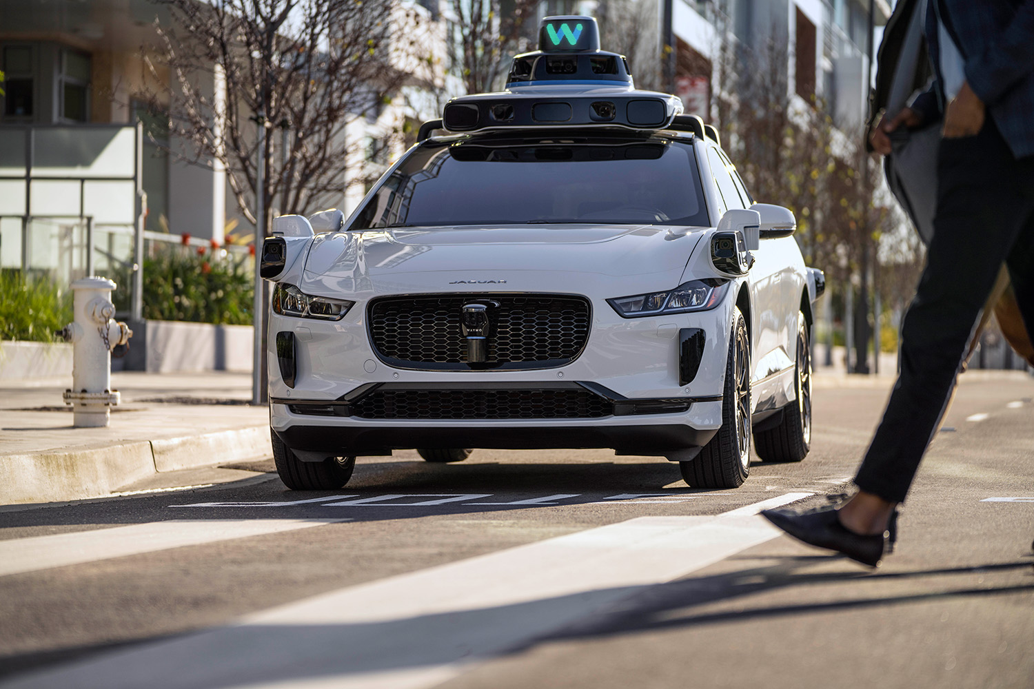 Waymo autonomous self-driving Jaguar I-Pace Electric SUV parked on curb in San Fransisco