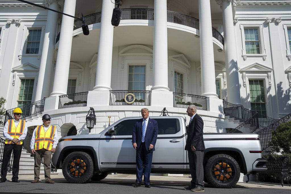 Donald Trump with a Lordstown Endurance pickup truck, General Motors sold its stake in Lordstown Motors.