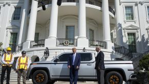 Donald Trump with a Lordstown Endurance pickup truck, General Motors sold its stake in Lordstown Motors.