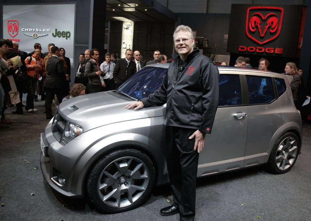 Man standing next to a silver Dodge Hornet concept, highlighting release date and price of 2023 Dodge Hornet