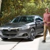 Man walking dog by 2022 Honda Accord, the U.S. News best midsize car for families to buy in 2022
