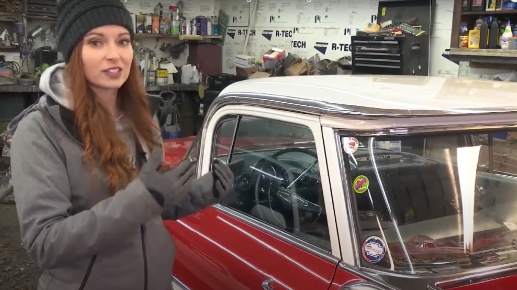 Melanie Henry, founder of Mel's Cars Shows, standing next to 1959 El Camino