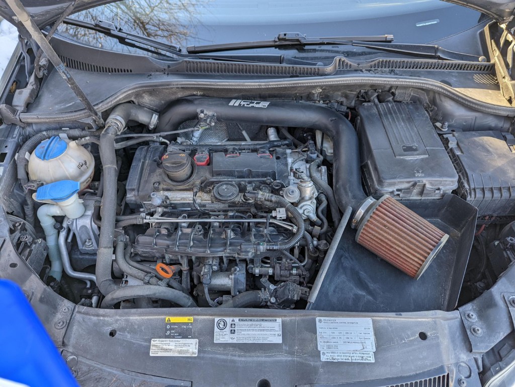 A 2013 Volkswagen Golf R modified with an APR tune and CTS cold-air intake