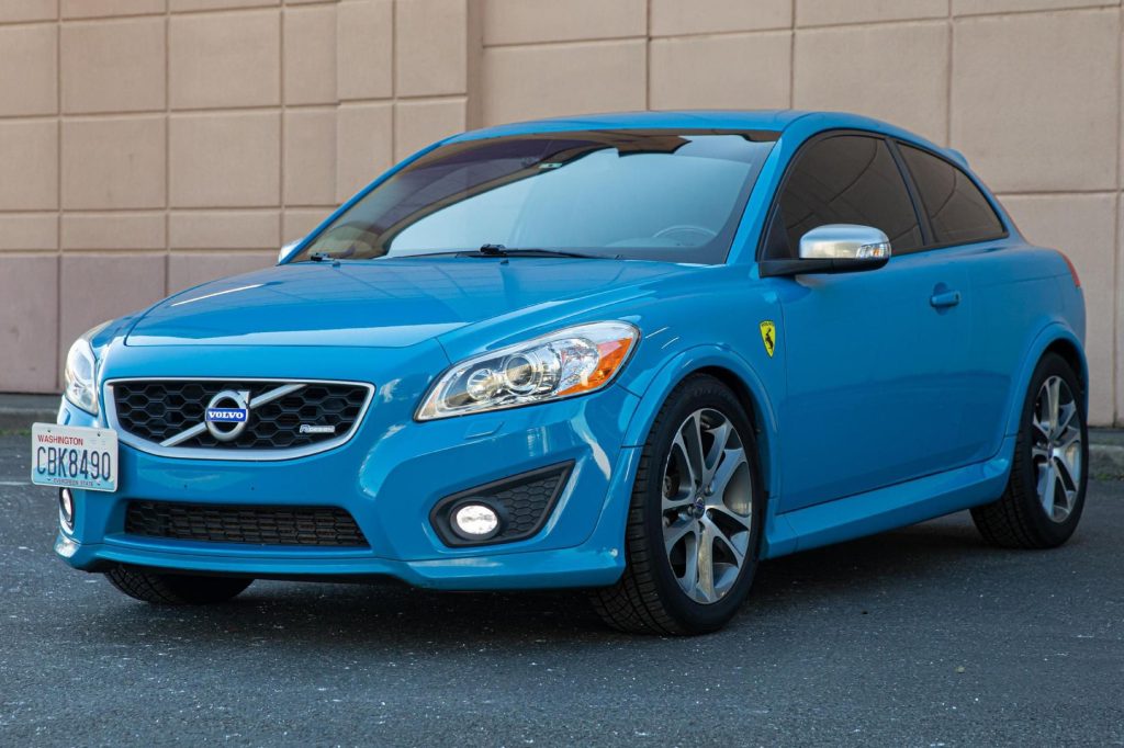 A blue modified 2013 Volvo C30 R-Design with Polestsar tune in a parking lot