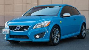 A blue modified 2013 Volvo C30 R-Design with Polestsar tune in a parking lot
