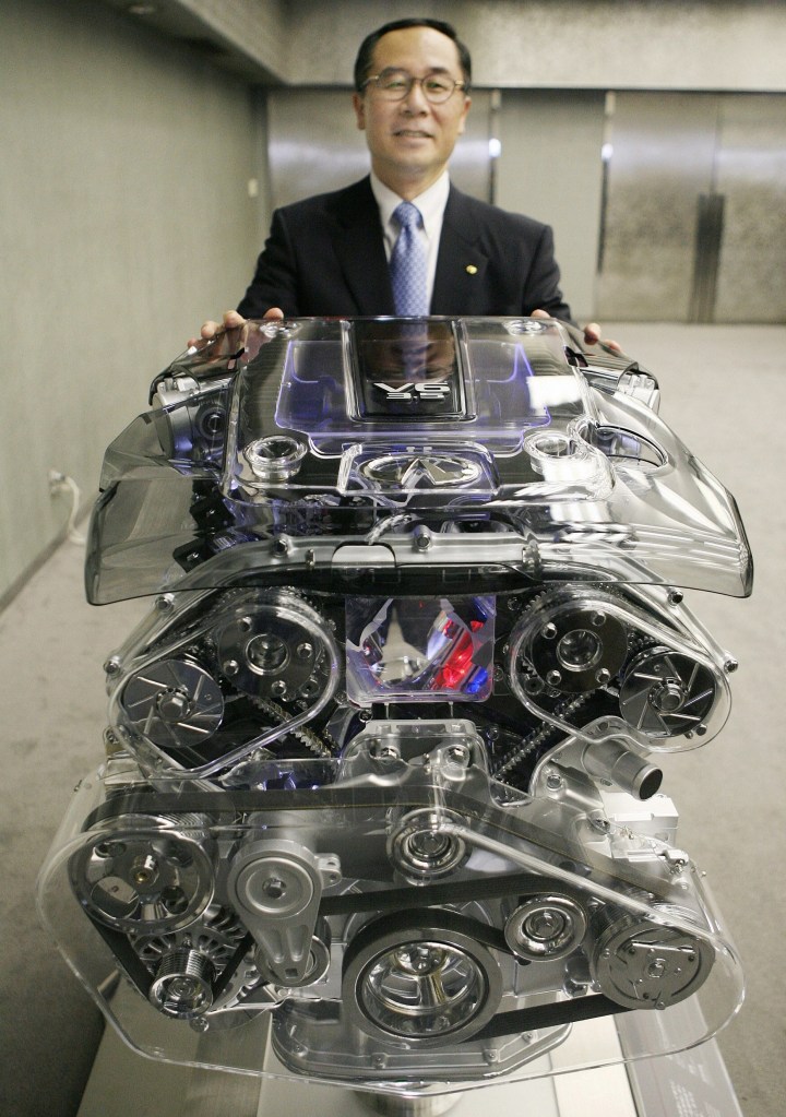 Nissan Motor Managing Director Yo Usuba with a cutaway VQ35HR V6