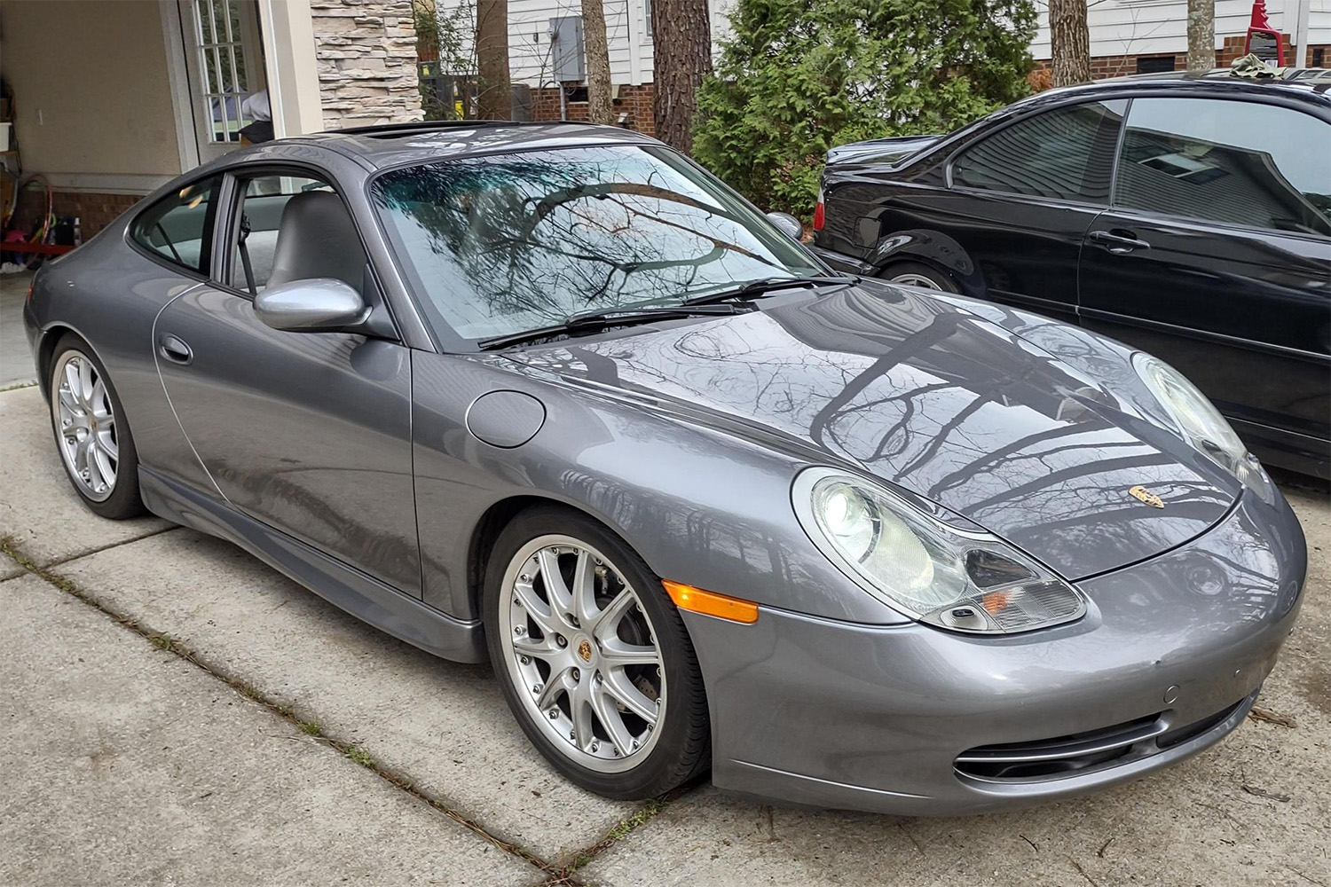 Silver 2001 Porsche 991 911 Carrera base with six-speed manual transmission, sport package, and technic package