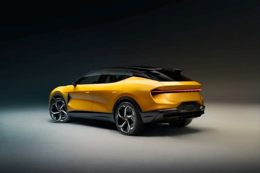 Rear angle view of yellow 2024 Lotus Eletre, highlighting its release date and price