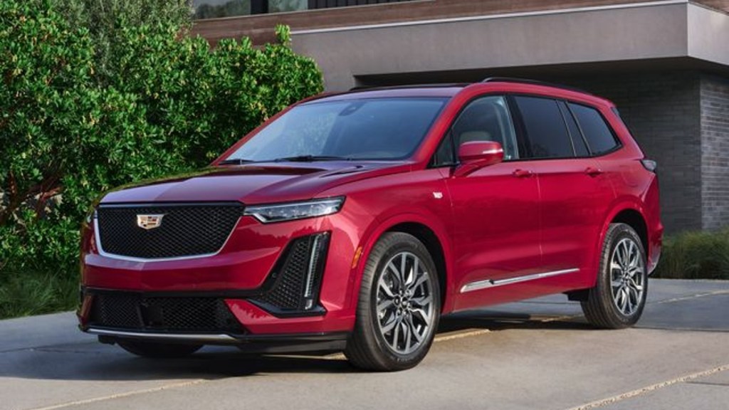 Red 2022 Cadillac XT6 parked in a driveway
