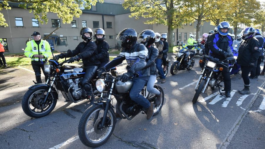 Gear-clad riders and passengers on motorcycles take part in a 'ride of respect' in the UK