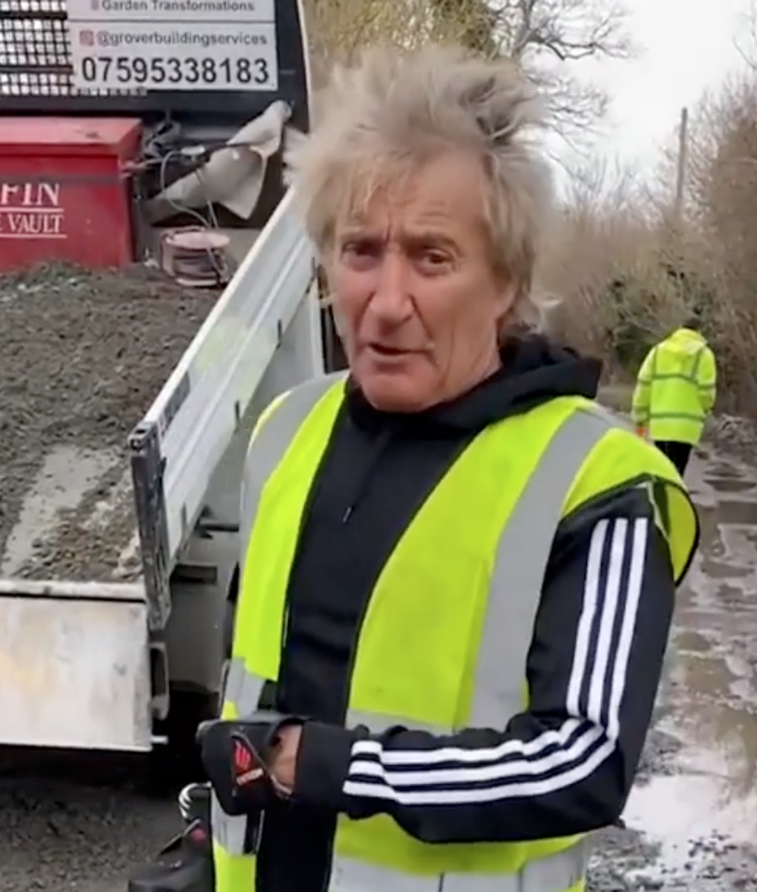 Rod stewart fixing a pothole