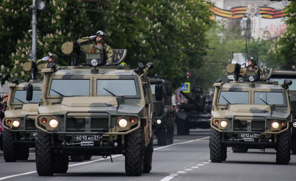 Russian troop carriers powered by Cummins engines parading through Crimea.