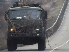 Russian Military Uses Wood Logs for Armor on Convoy Trucks