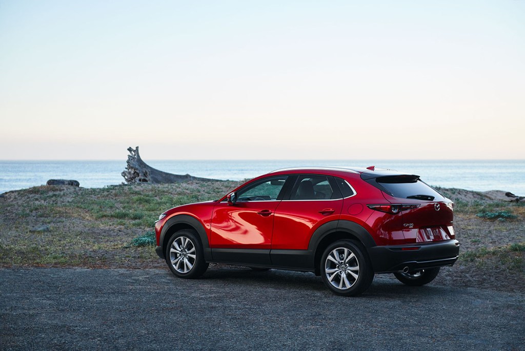 Soul Red Crystal Metallic 2022 Mazda CX-30 parked near the ocean
