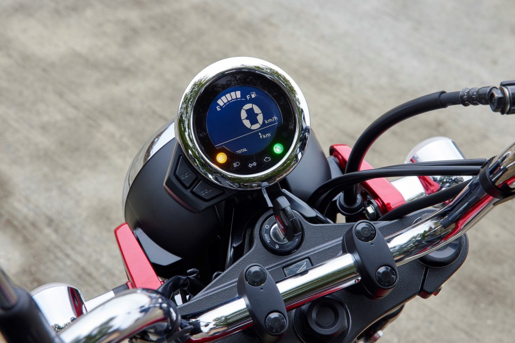 The 2023 Honda ST125 Dax's LCD gauge with speedometer, warning lights, and fuel meter