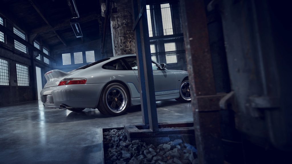 A rear side 3/4 view of the gray 996 Porsche 911 Classic Club Coupe