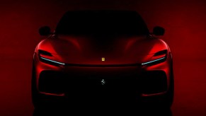 A red Ferrari Purosangue teaser.