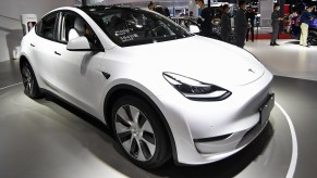 A white Tesla Model Y is on display.