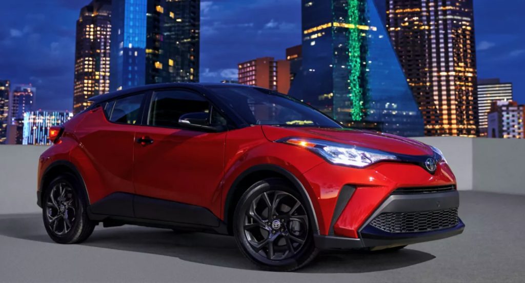 A red 2022 Toyota C-HR subcompact SUV is parked. 
