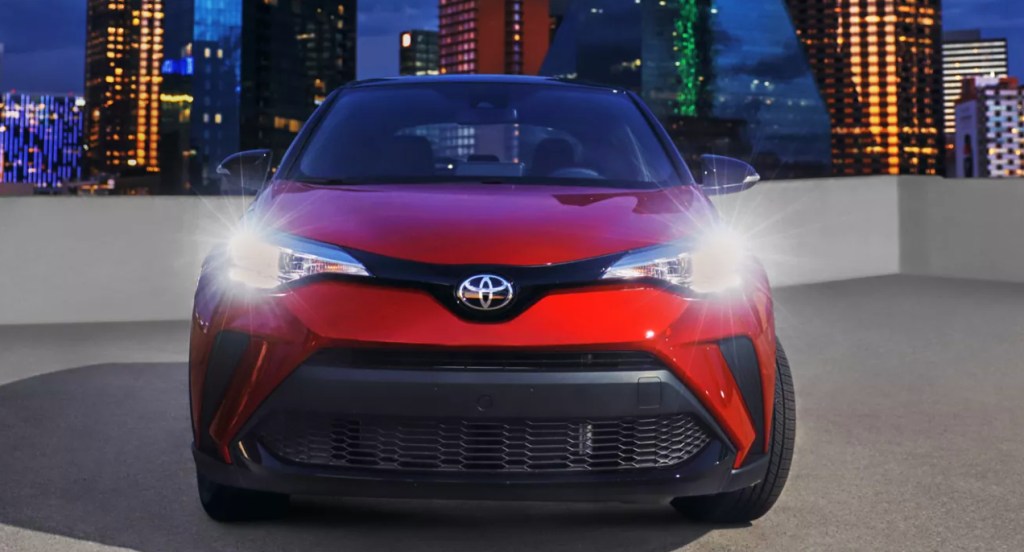 A red 2022 Toyota C-HR subcompact SUV is parked. 