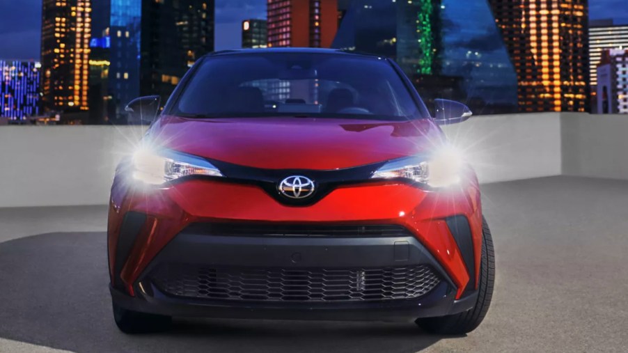 A red 2022 Toyota C-HR subcompact SUV is parked.