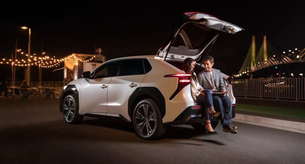 A white 2023 Toyota bZ4X is parked.