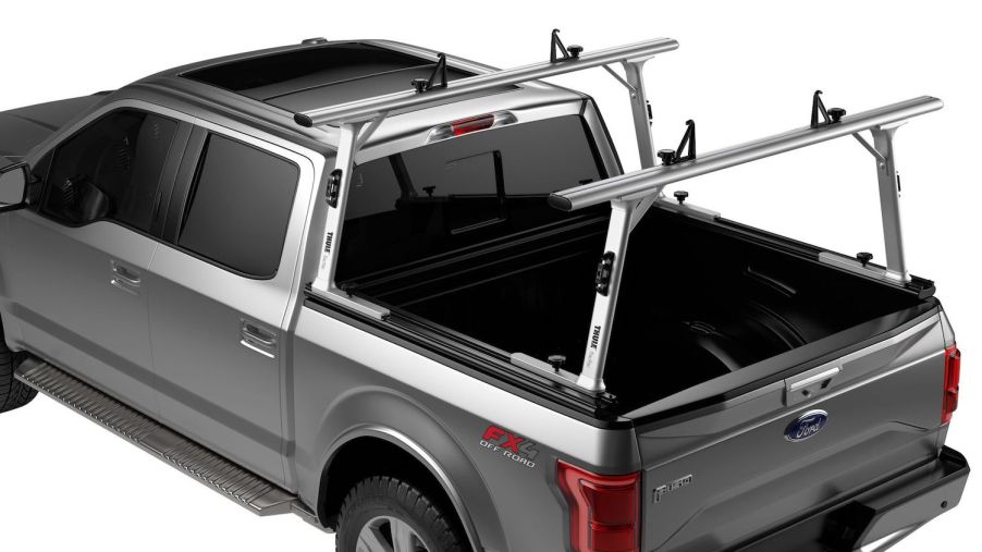 Promo photo of an aluminum ladder rack on a gray Ford F-150 pickup truck.