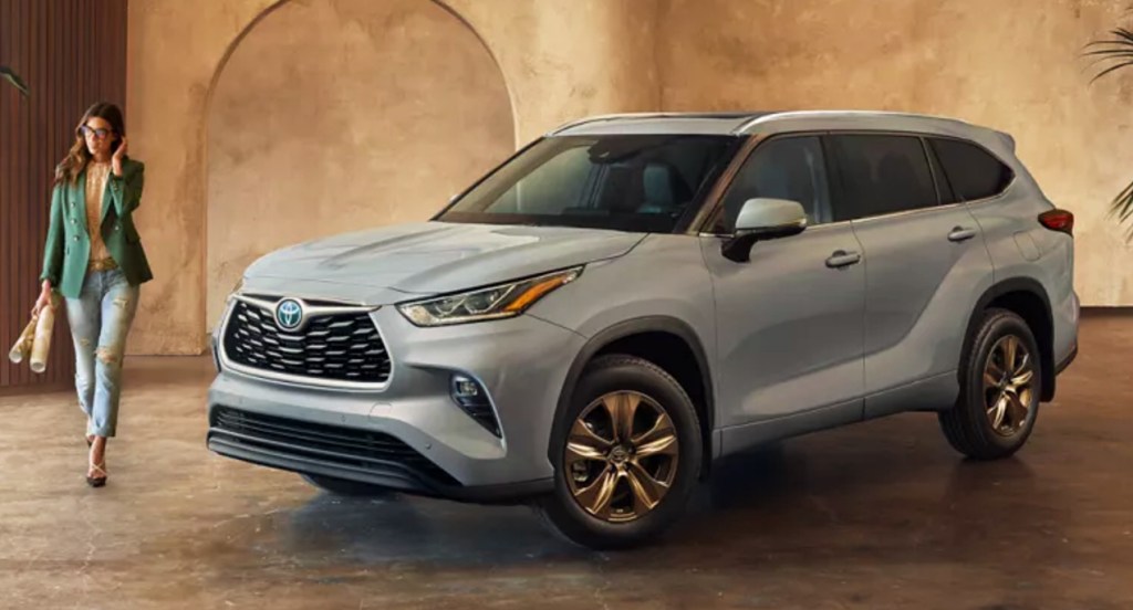 A gray 2022 Toyota Highlander Hybrid is parked indoors. 