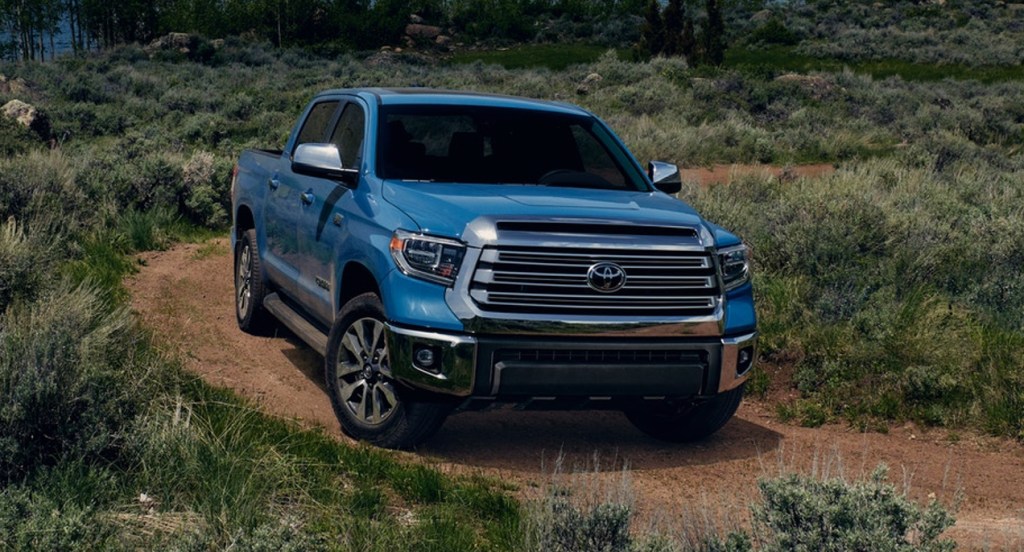 A blue 2021 Toyota Tundra full-size pickup truck is parked off-road. 