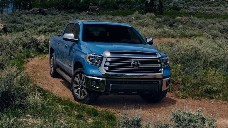 A blue 2021 Toyota Tundra is parked off-road.