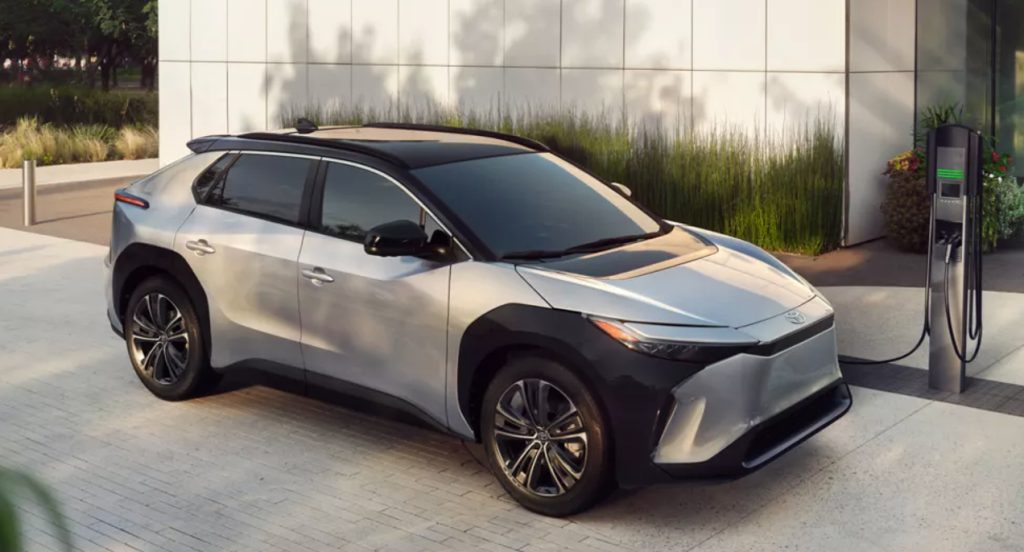 A silver 2023 Toyota bZ4X electric SUV is charging. 