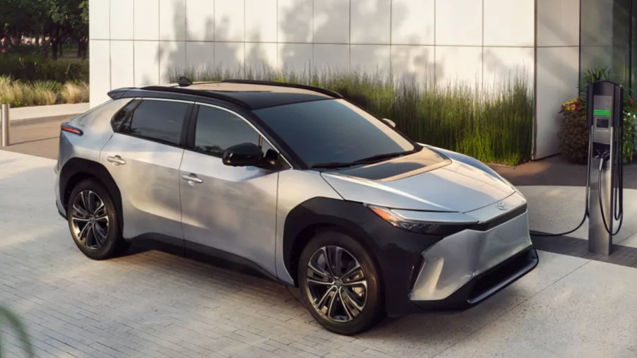 A silver 2023 Toyota bZ4X electric SUV is charging.