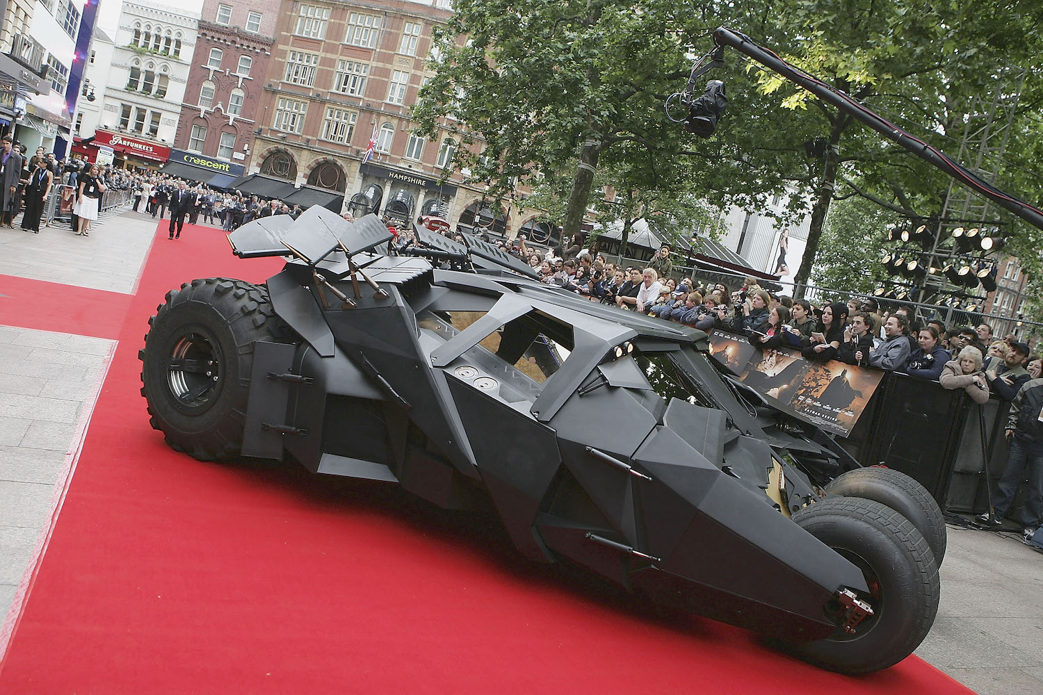 Movie prop Batmobile Tumbler driving the red carpet at the UK premier of Batman Begins.