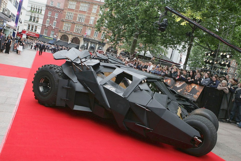 Movie prop Batmobile Tumbler driving the red carpet at the UK premier of Batman Begins.