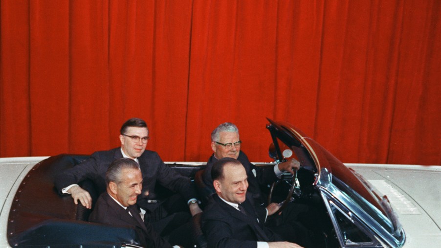 Airline Captain Stanley Tucker with Lee Iacocca and Ford executives in the one-millionth Ford Mustang