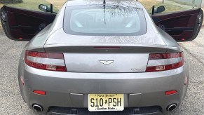 Rear end of 2007 Aston Martin V8 Vantage with doors open