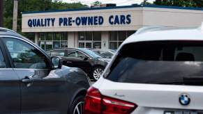 A close up of used cars for sale on a lot.